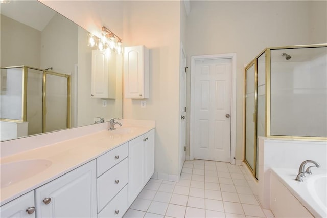 bathroom with tile patterned flooring, vaulted ceiling, vanity, and shower with separate bathtub