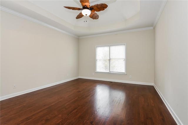 5055 Hickory Hills Dr, Woodstock, GA 30188 - empty room featuring crown molding, ceiling fan, baseboards, dark wood-type flooring, and a raised ceiling