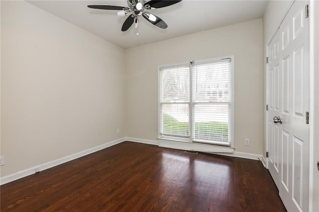 5055 Hickory Hills Dr, Woodstock, GA 30188 - spare room featuring ceiling fan, baseboards, and dark wood finished floors