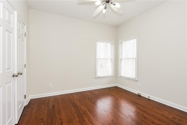 5055 Hickory Hills Dr, Woodstock, GA 30188 - empty room featuring ceiling fan, visible vents, baseboards, and dark wood-style floors