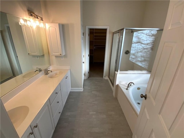 5055 Hickory Hills Dr, Woodstock, GA 30188 - full bath with double vanity, a garden tub, a shower stall, and a sink