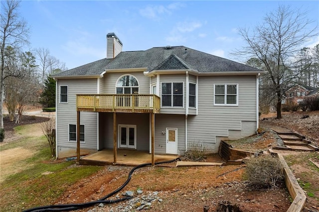 back of house featuring a patio and a deck