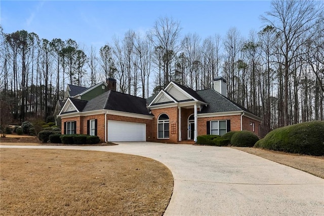 5055 Hickory Hills Dr, Woodstock, GA 30188 - neoclassical home with brick siding, driveway, and a chimney