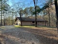 view of home's exterior featuring gravel driveway