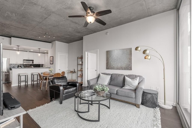 living room featuring hardwood / wood-style flooring and ceiling fan