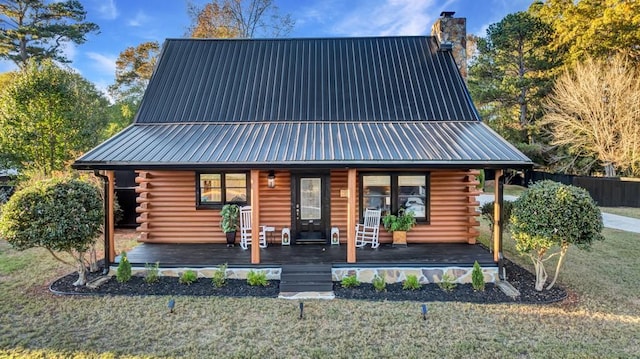 923 Pine Cir, Woodstock, GA 30189 - log home featuring covered porch, log exterior, a chimney, and metal roof