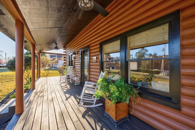 wooden deck featuring ceiling fan and a porch