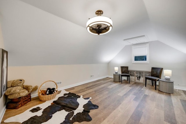 bonus room with light hardwood / wood-style flooring and lofted ceiling