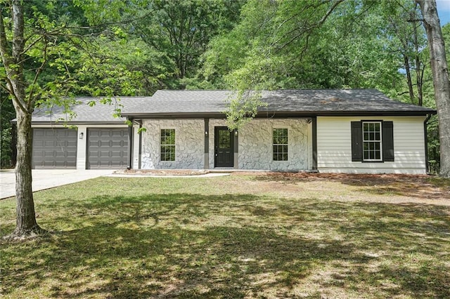 ranch-style house with an attached garage, a front lawn, stone siding, and concrete driveway