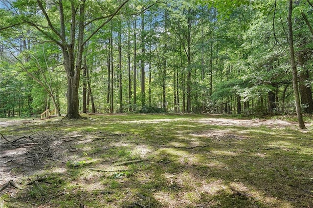 view of yard with a forest view