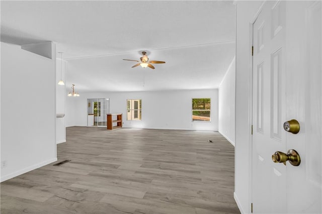 1437 Frank Lovell Rd, Clarkesville, GA 30523 - unfurnished living room with visible vents, a ceiling fan, baseboards, and wood finished floors