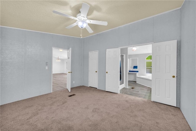 1437 Frank Lovell Rd, Clarkesville, GA 30523 - unfurnished bedroom with crown molding, carpet floors, a textured ceiling, and connected bathroom