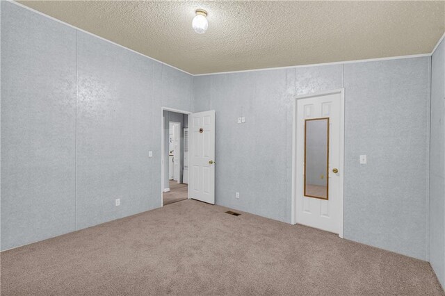1437 Frank Lovell Rd, Clarkesville, GA 30523 - carpeted empty room with ornamental molding, a textured ceiling, and visible vents