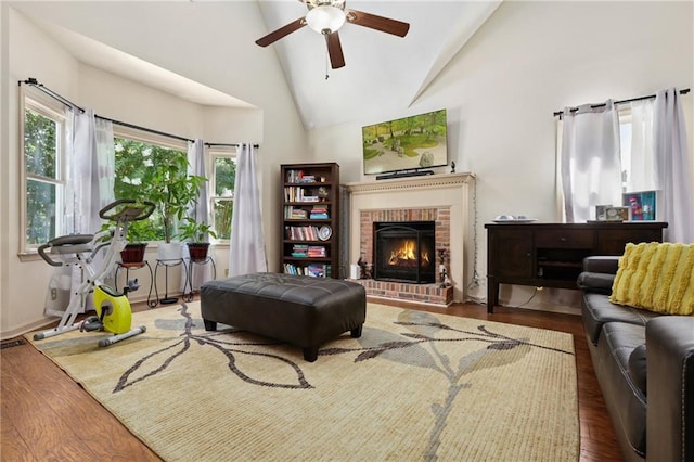 210 N Wesleyan Cir, Macon, GA 31210 - living area featuring a ceiling fan, vaulted ceiling, wood finished floors, and a fireplace