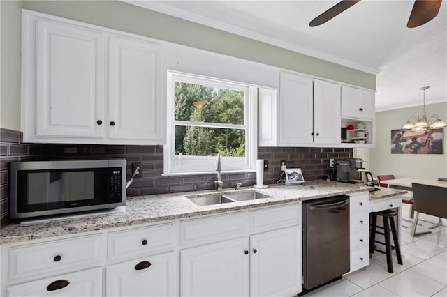 210 N Wesleyan Cir, Macon, GA 31210 - kitchen with dishwasher, stainless steel microwave, ornamental molding, backsplash, and ceiling fan