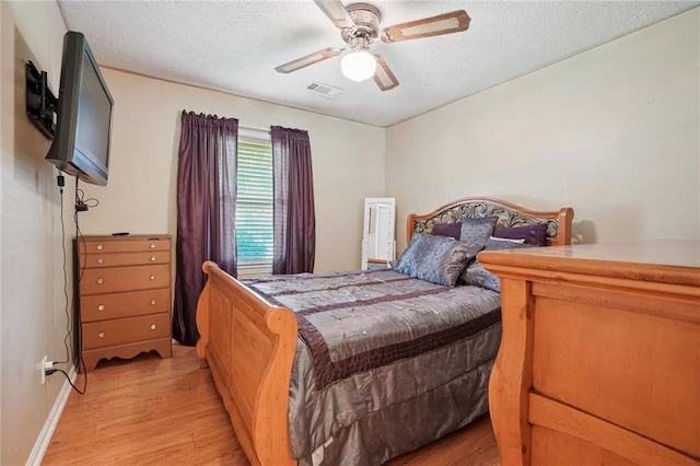 bedroom featuring ceiling fan and light wood-type flooring