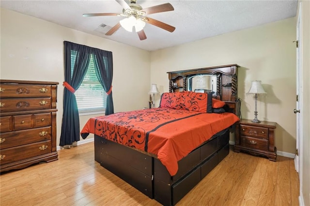 bedroom featuring light wood-type flooring and ceiling fan