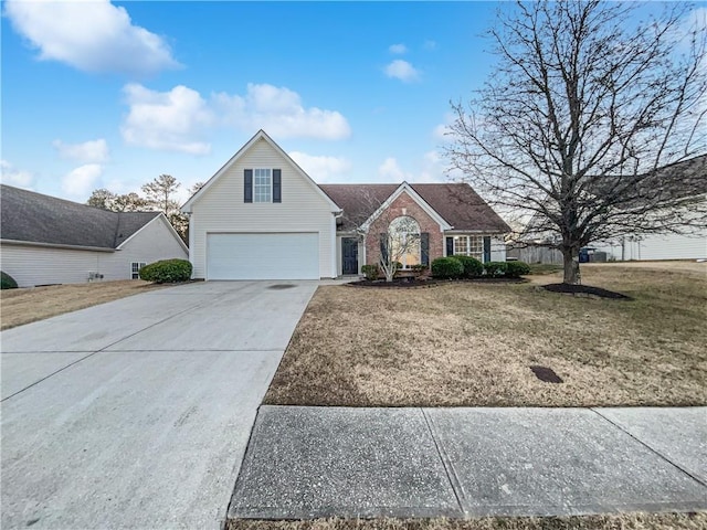 front of property with a garage and a front lawn