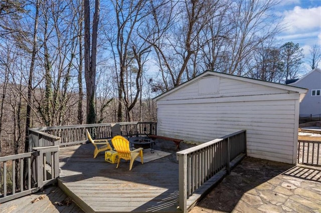 wooden terrace with a fire pit