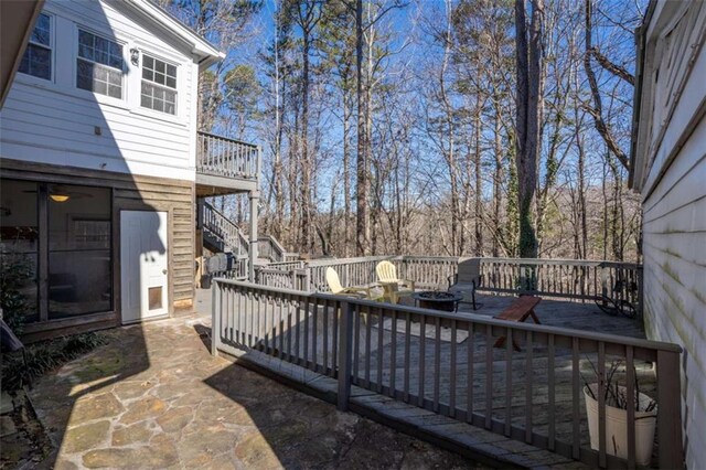 wooden terrace with an outdoor fire pit