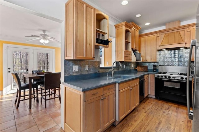 kitchen featuring backsplash, ceiling fan, crown molding, sink, and black appliances