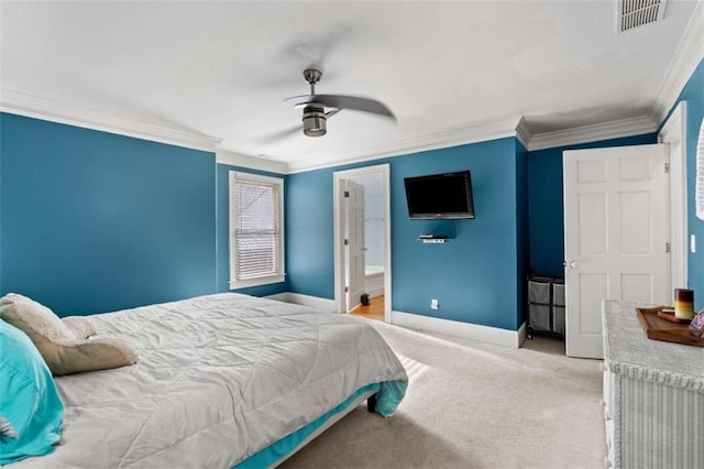 carpeted bedroom with ceiling fan, crown molding, and ensuite bathroom