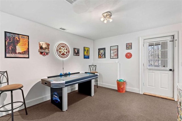 game room featuring dark carpet