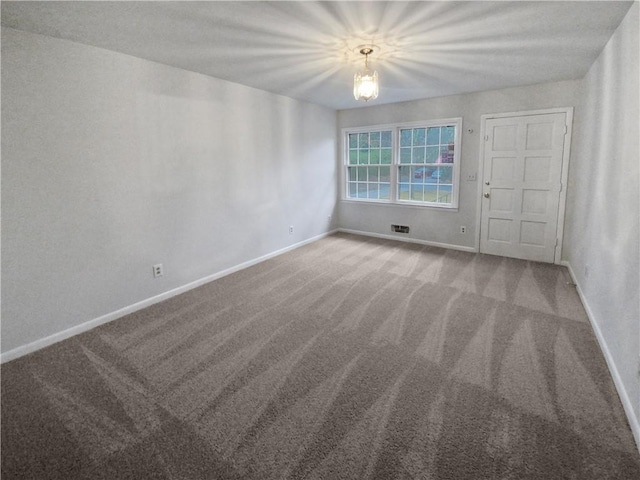 spare room with carpet floors