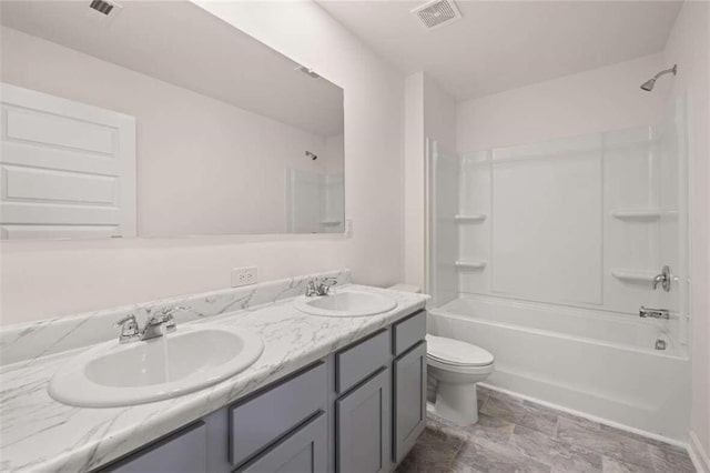full bathroom with visible vents, toilet, bathtub / shower combination, and a sink