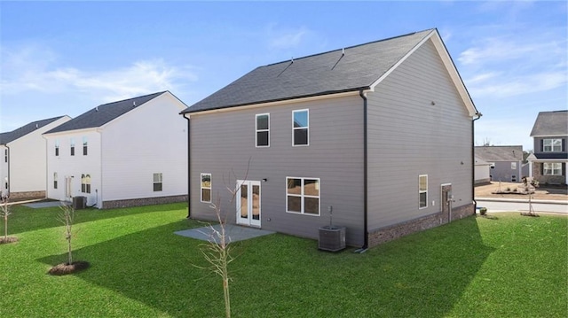 back of house featuring a yard, a patio, and central AC unit