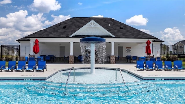 pool featuring a patio and fence