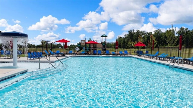 pool featuring a patio and fence
