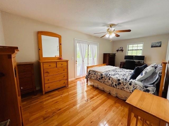 1008 Lakeview Acres, Hiawassee, GA 30546 - bedroom featuring access to exterior, light wood finished floors, ceiling fan, and baseboards