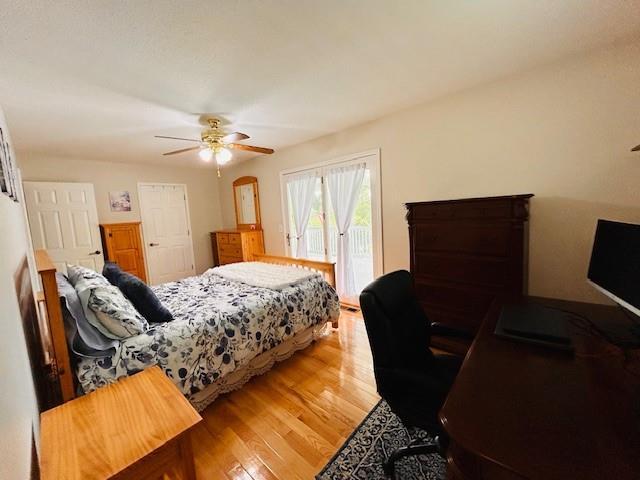1008 Lakeview Acres, Hiawassee, GA 30546 - bedroom featuring access to exterior, wood finished floors, and a ceiling fan