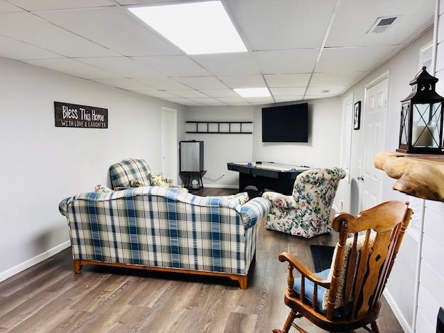 1008 Lakeview Acres, Hiawassee, GA 30546 - living room with a drop ceiling, wood finished floors, and baseboards