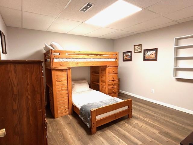 1008 Lakeview Acres, Hiawassee, GA 30546 - bedroom with a drop ceiling, wood finished floors, and baseboards