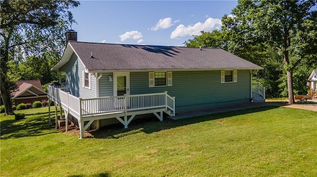 1008 Lakeview Acres, Hiawassee, GA 30546 - rear view of house featuring a chimney, a yard, roof with shingles, and a wooden deck