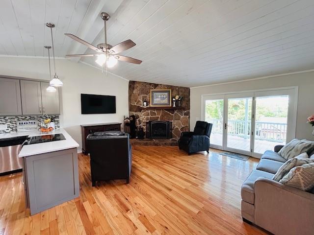1008 Lakeview Acres, Hiawassee, GA 30546 - living room featuring light wood finished floors, a ceiling fan, a fireplace, and wood ceiling