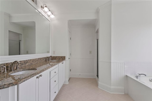 4100 Paces Walk SE Unit 4306, Atlanta, GA 30339 - bathroom with a stall shower, a garden tub, tile patterned flooring, a wainscoted wall, and double vanity