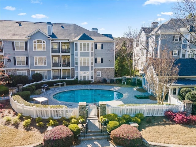 4100 Paces Walk SE Unit 4306, Atlanta, GA 30339 - view of swimming pool with a gate and a fenced front yard