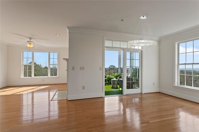 4100 Paces Walk SE Unit 4306, Atlanta, GA 30339 - empty room featuring ornamental molding, baseboards, plenty of natural light, wood finished floors, and a chandelier