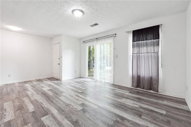 3799 Henry Ct, Acworth, GA 30101 - spare room with wood finished floors, a textured ceiling, and baseboards