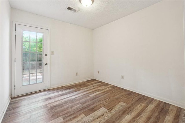 3799 Henry Ct, Acworth, GA 30101 - spare room featuring wood finished floors, baseboards, and a textured ceiling