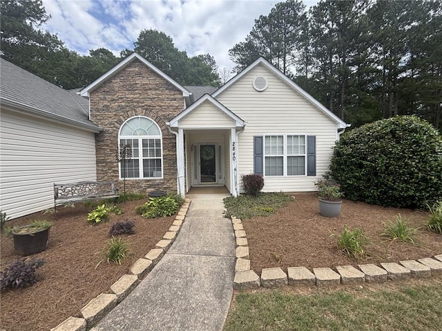 2840 Alcovy River Vw, Dacula, GA 30019 - traditional-style home with stone siding