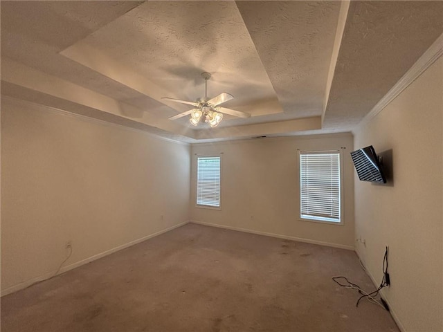 2840 Alcovy River Vw, Dacula, GA 30019 - empty room featuring a tray ceiling, a textured ceiling, baseboards, ceiling fan, and light colored carpet