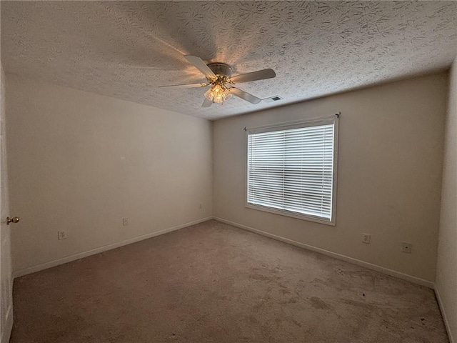 2840 Alcovy River Vw, Dacula, GA 30019 - spare room featuring light colored carpet, ceiling fan, baseboards, and a textured ceiling