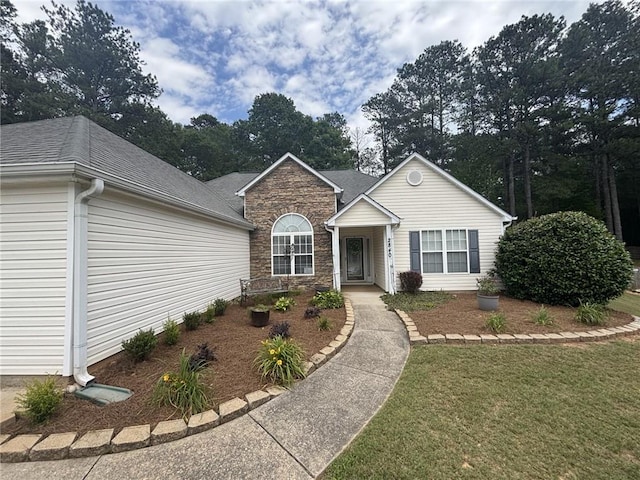 2840 Alcovy River Vw, Dacula, GA 30019 - ranch-style house featuring stone siding, a front lawn, and a shingled roof