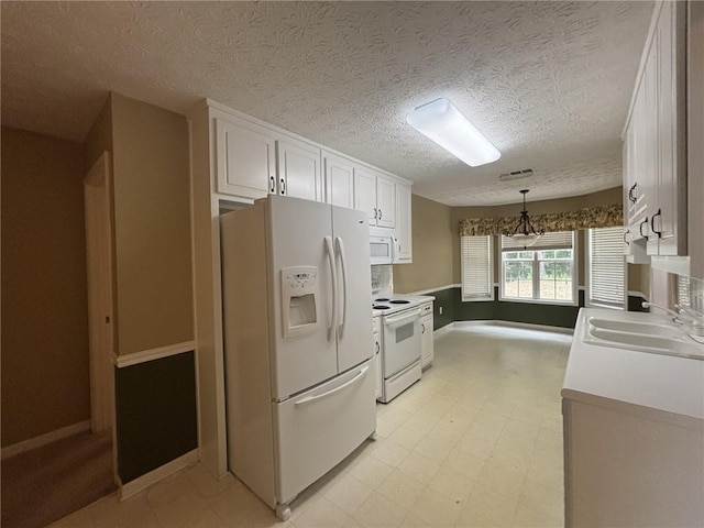 2840 Alcovy River Vw, Dacula, GA 30019 - kitchen featuring white appliances, a sink, white cabinetry, light flooring, and baseboards