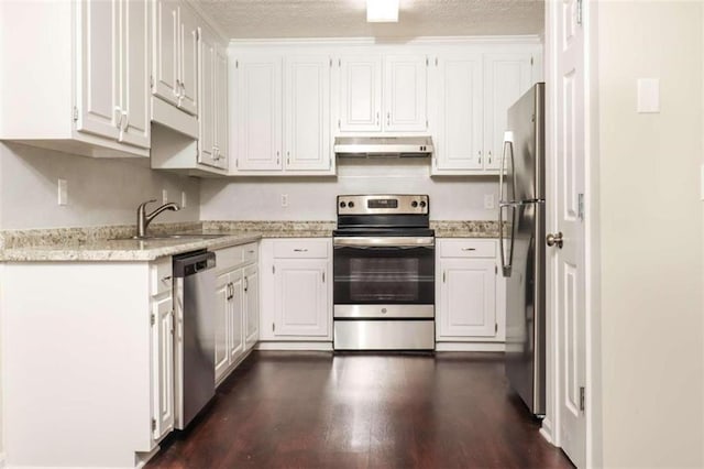 kitchen featuring white cabinets, sink, dark hardwood / wood-style floors, a textured ceiling, and stainless steel appliances