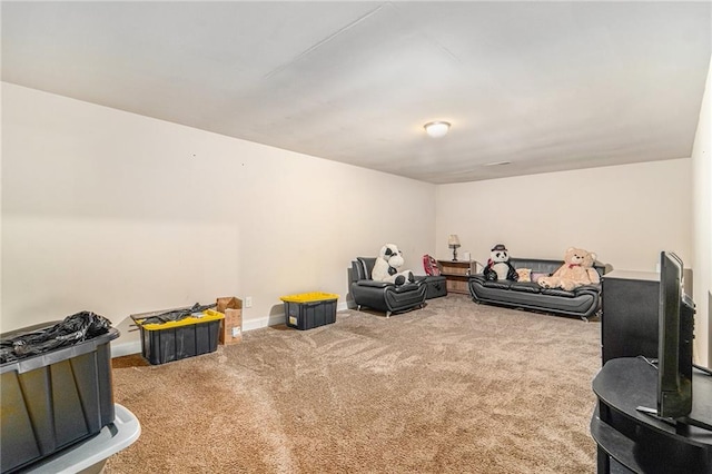 recreation room featuring baseboards and carpet floors